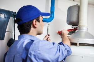 Plumber repairing an hot-water heater