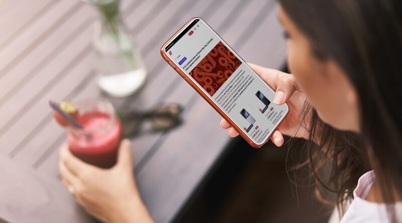 Upper angle shot young tanned woman holding smartphone sit outdo