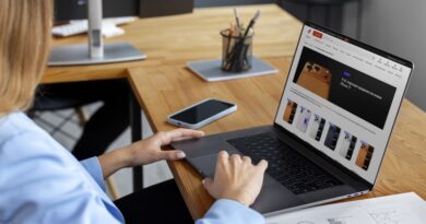 Women using digital tablet together