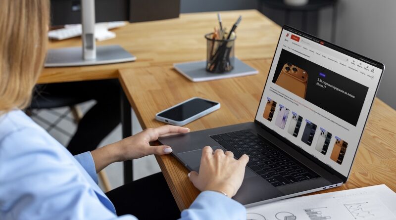Women using digital tablet together