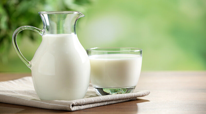 Fresh,Milk,On,Wooden,Table,Against,Blurred,Background,,Space,For